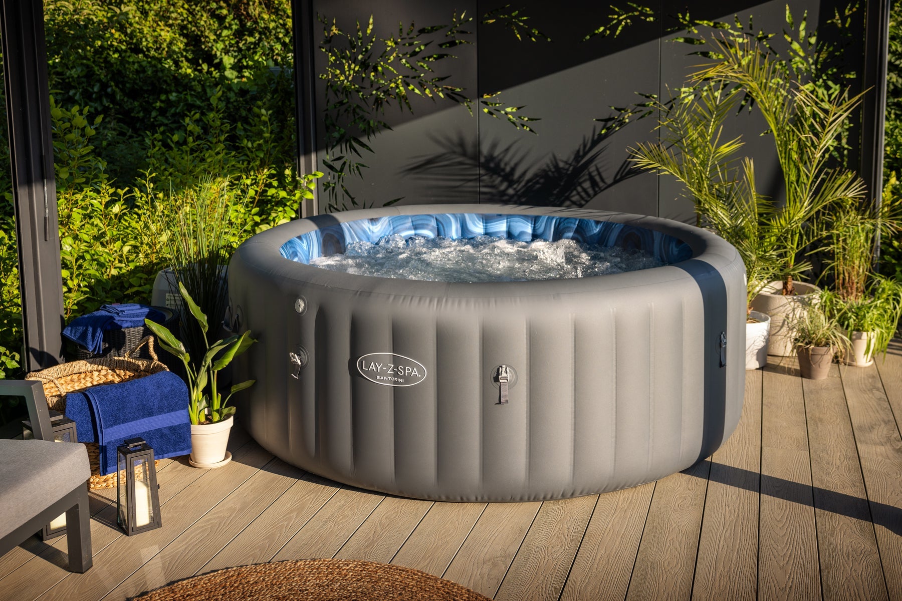 Large grey round inflatable hot tub with seats
